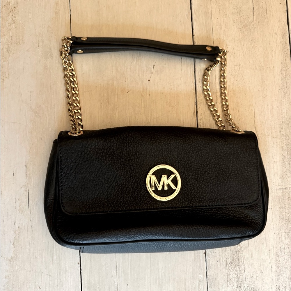 Used Black with gold trim Michael Kors small purse.